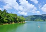 In the tropical morning light, Malaysia's Lake Temengor is a glazed expanse of emerald green, deepened by the dense walls of rainforest surrounding it.